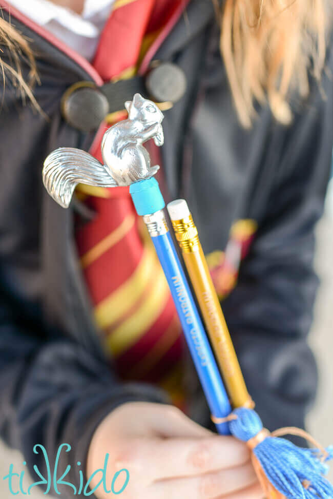 Sek of pencils in Hogwarts House colors with "expecto Patronum" written on the pencils, a chocolate shaped eraser and pencil sharpener, and a silver patronus pencil topper.