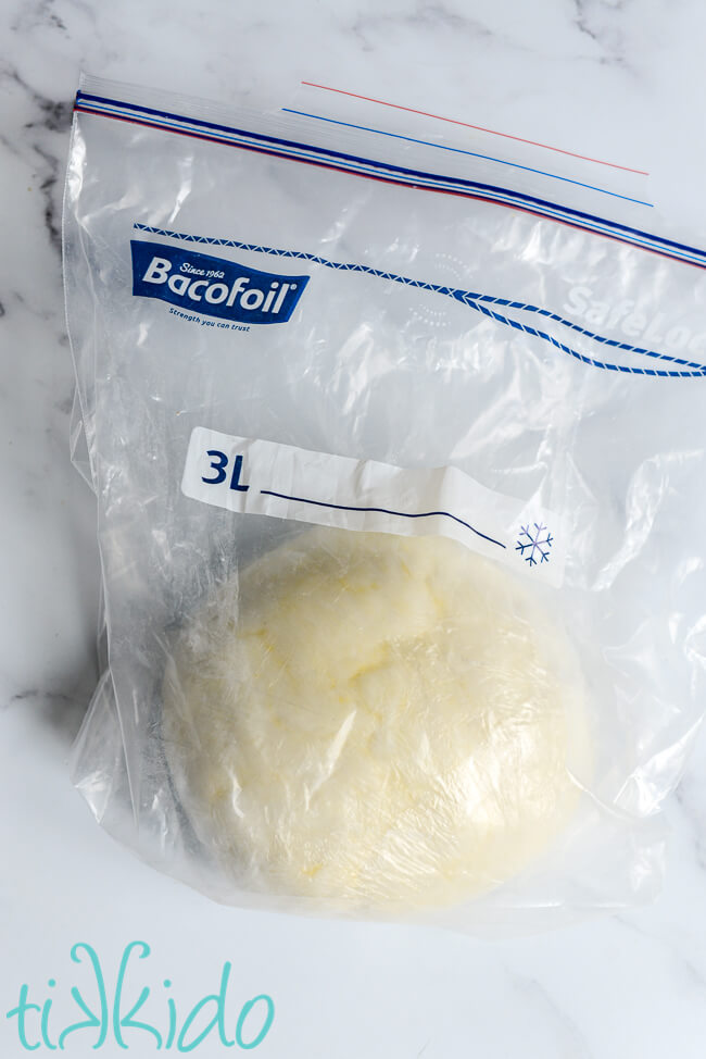 Homemade fondant covered in cling wrap and stored in a ziplock bag.