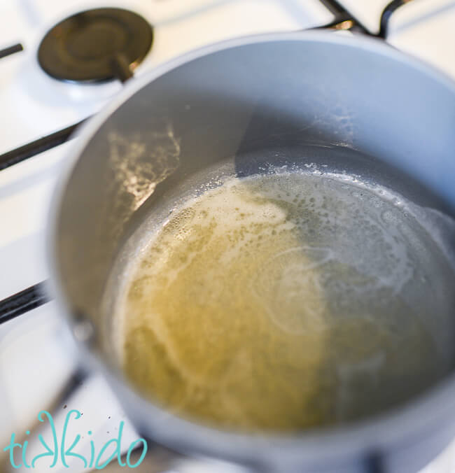 Gelatin melting in a small pot to make Fondant Recipe.