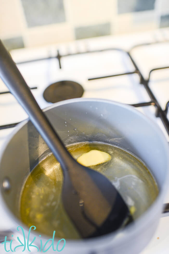 Ingredients being mixed into melted gelatin to make homemade rolled fondant.