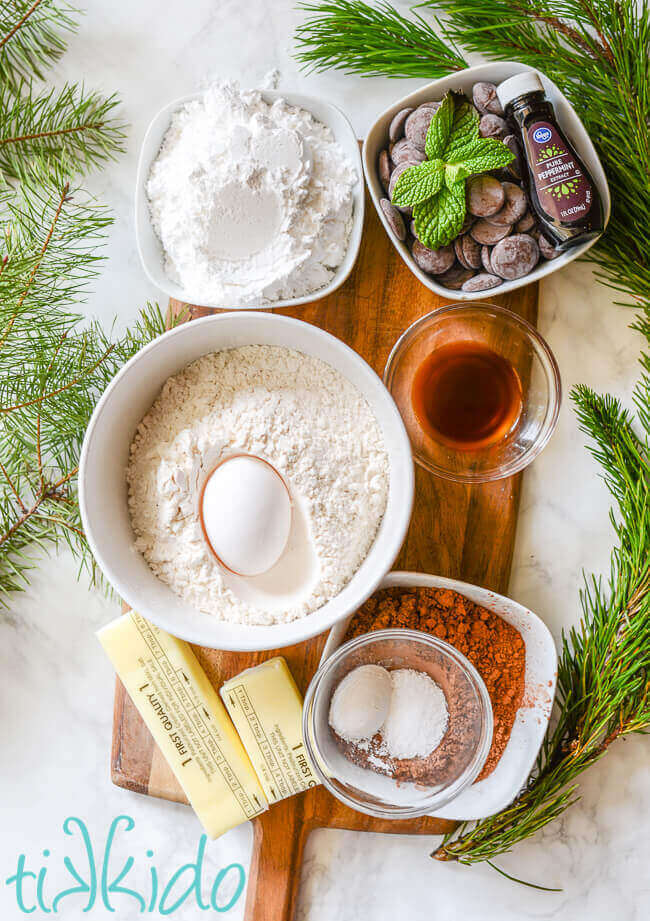 Ingredients for thin mints recipe on a wooden cutting board.