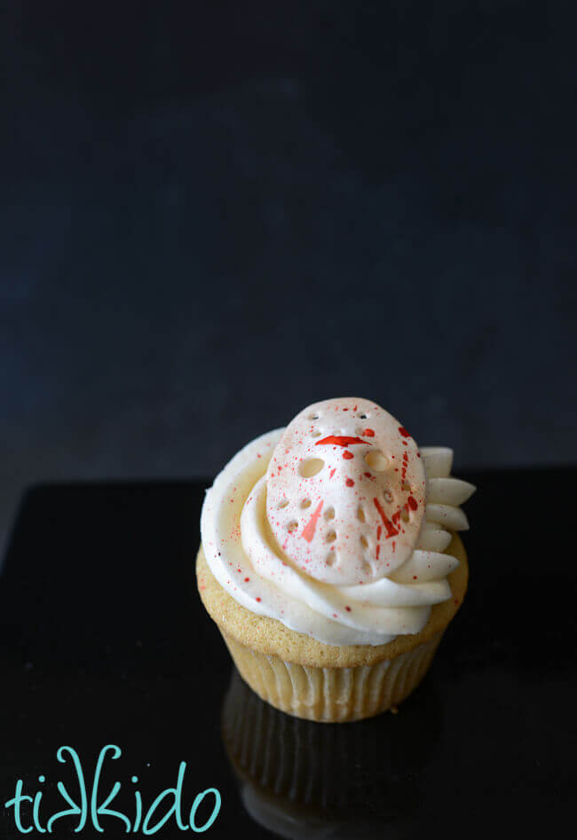 Friday the 13th horror movie cupcake featuring a blood spattered gum paste Jason mask.