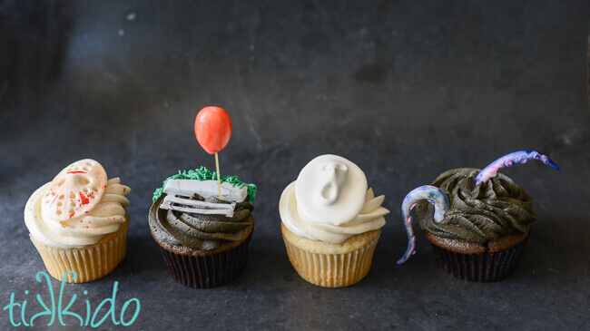 Horror movie themed cupcakes on a black background.