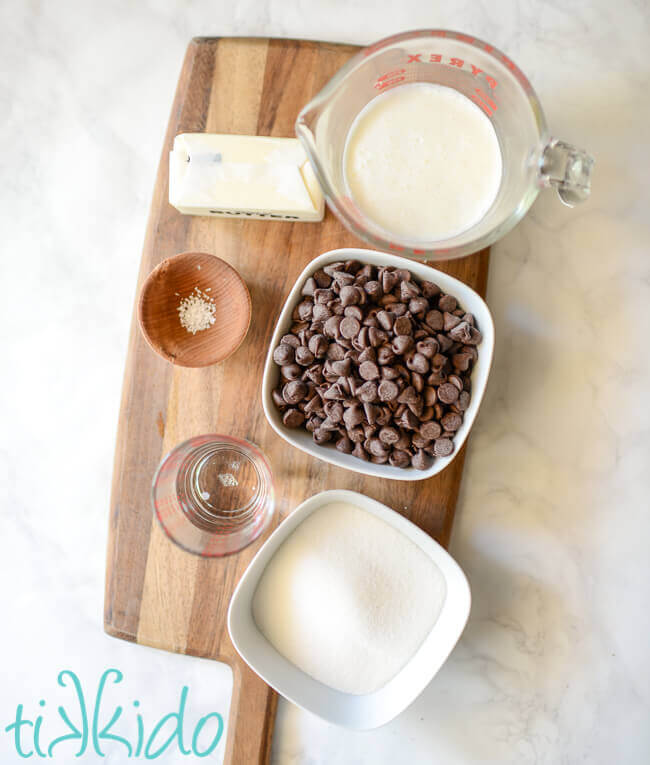 Hot Fudge Sauce ingredients on a wooden cutting board.