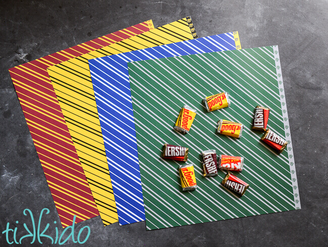 Harry potter inspired scrapbook paper and miniature Hershey's chocolate bars on a black chalkboard background.