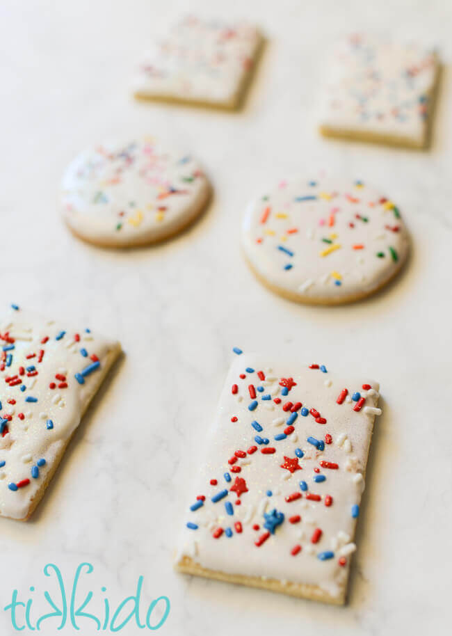 Sugar cookies dipped in royal icing and covered in sprinkles.