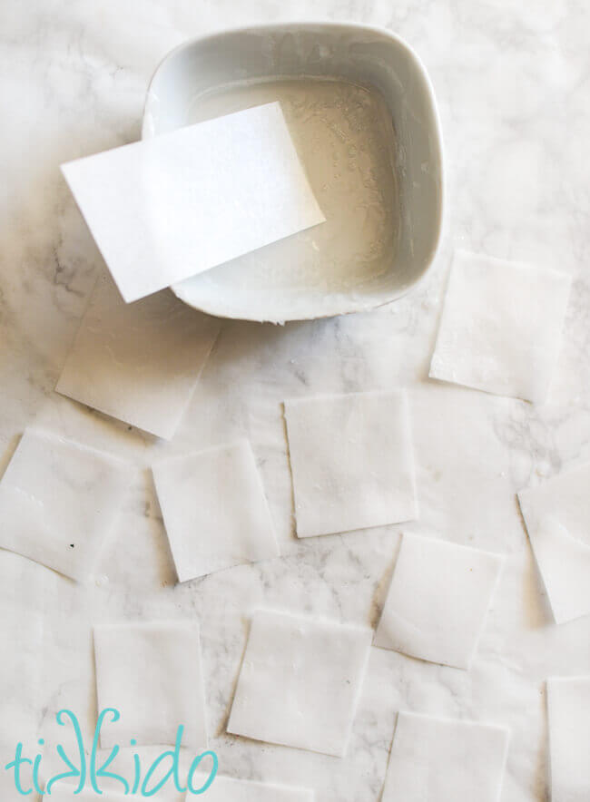 Small pieces of wafer paper coated with melted melt and pour soap base to make Single Use Soaps