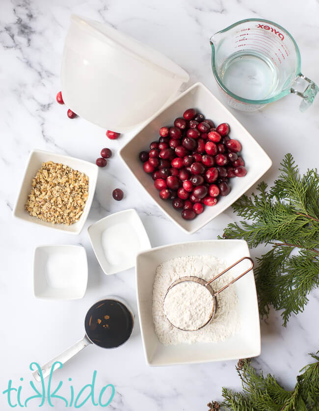 Ingredients for Christmas Pudding Recipe on a white marble surface.