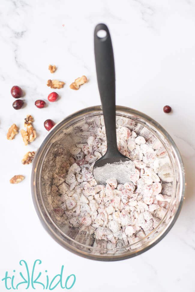 Cranberries and walnuts mixed with flour for a Christmas Pudding Recipe