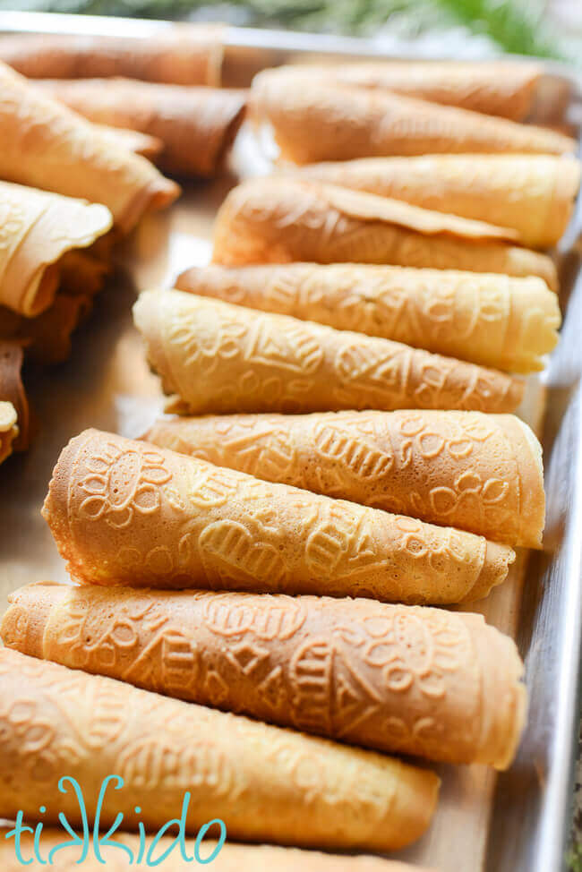 Krumkake cookies on a metal sheet pan