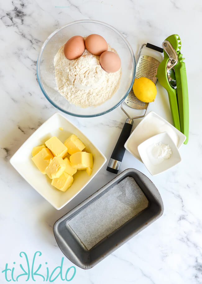 Ingredients for Madeira cake on a white marble surface.