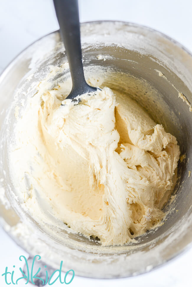 Madeira Cake batter in a mixing bowl with a black spatula.