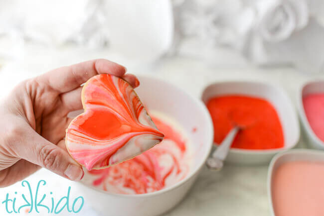 Marbled royal icing dipped sugar cookie heart.