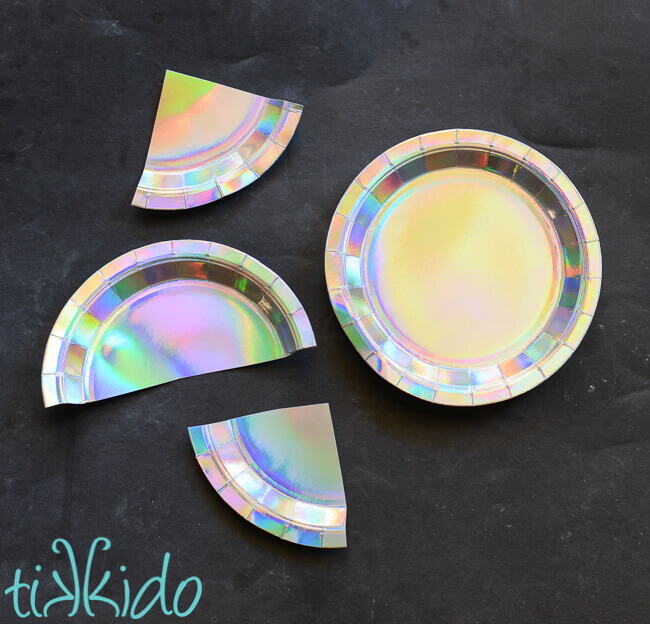 Paper plates cut into halves and quarters for the mermaid backdrop.
