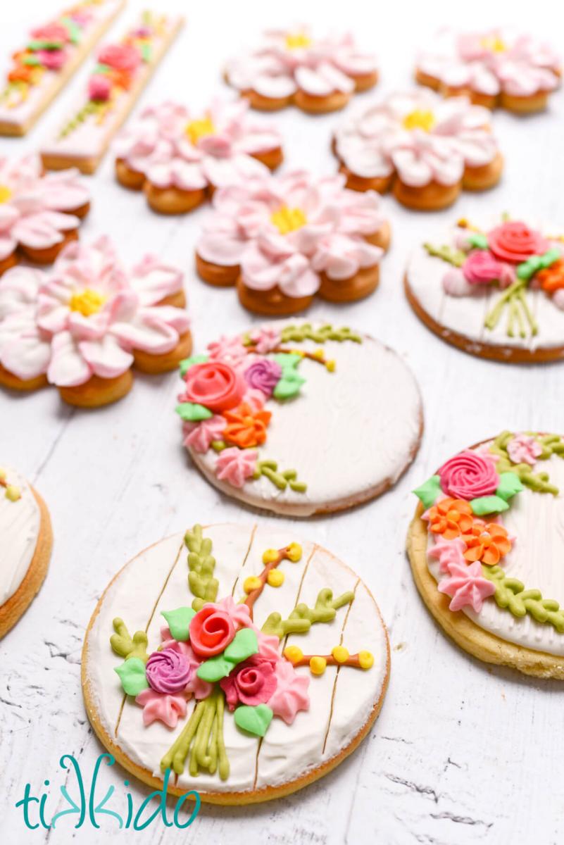 Spring Floral Sugar Cookies on a white wooden surface.