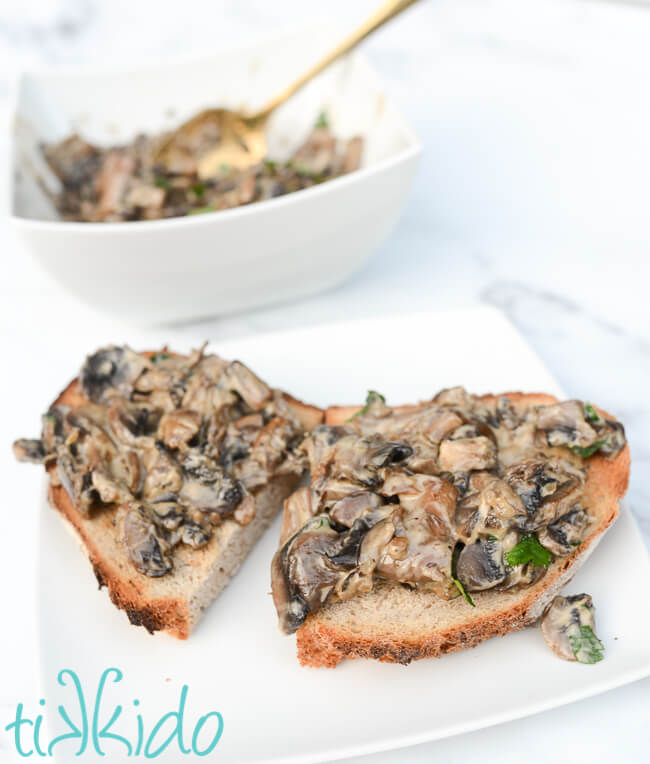 Classic creamy Mushrooms on Toast on a white plate.