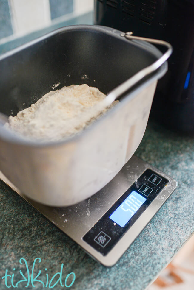 Neapolitan Pizza Dough ingredients being measured into a bread machine.