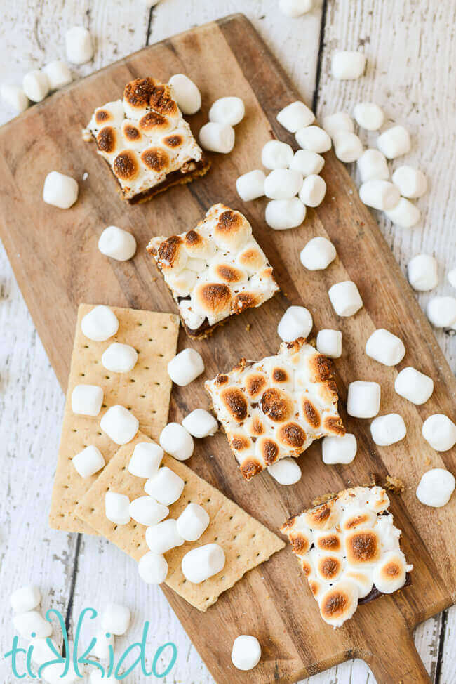 No Bake S'mores bar cookies on a wooden cutting board.