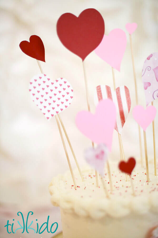 Dramatic, easy Valentine's Day Cake Topper on top of a plain white cake.