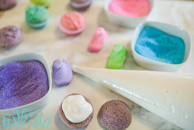 Easter whoopie pies being filled with homemade marshmallow filling for whoopie pies.