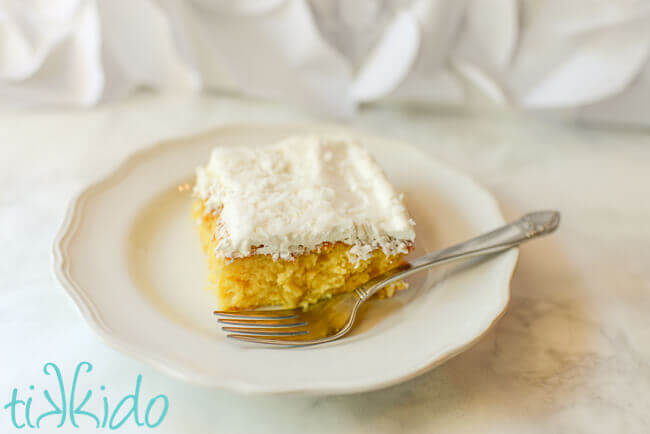 Pina Colada Poke Cake on a white plate