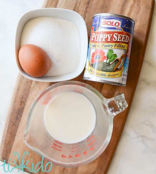 Ingredients for Poppy Seed Filling recipe on a wooden cutting board.