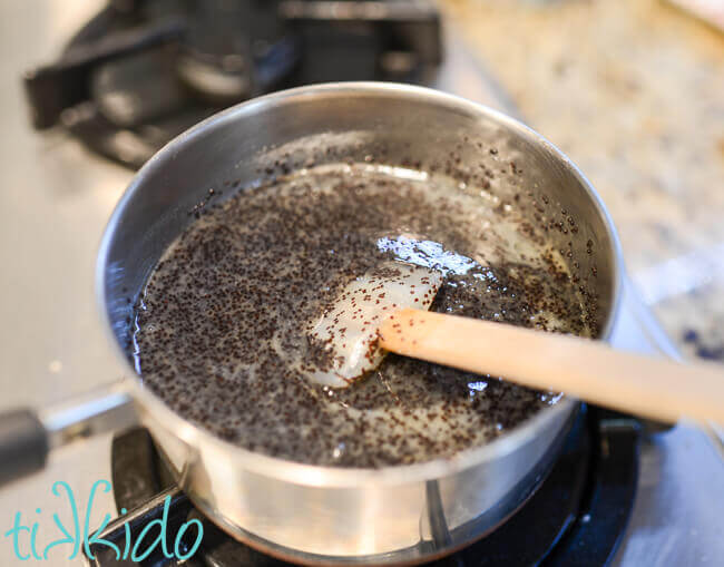 Poppy seed filling for poppy seed kolache being cooked in a small saucepan.
