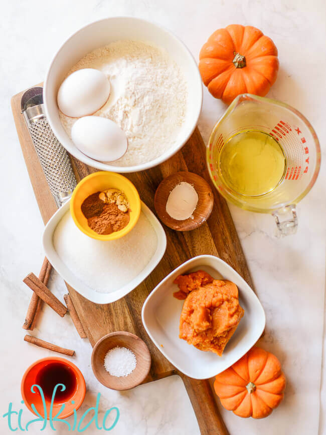 pumpkin biscotti ingredients on a wooden cutting board.