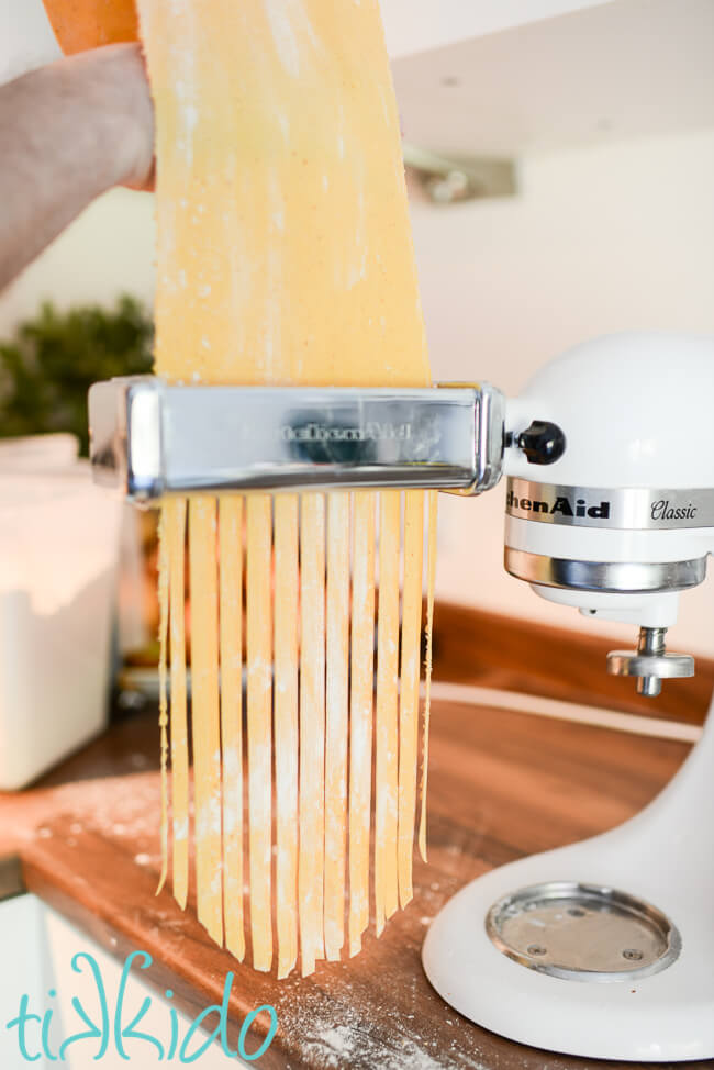 homemade pumpkin pasta being made with a Kitchenaid pasta attachment.