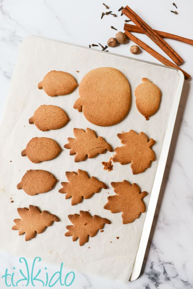 Freshly baked Pumpkin Spice Sugar Cookies on a parchment lined cookie sheet.