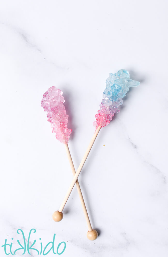 Pink and blue painted rock candy on white marble.