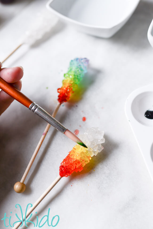 Rock candy being painted to make Rainbow Rock Candy