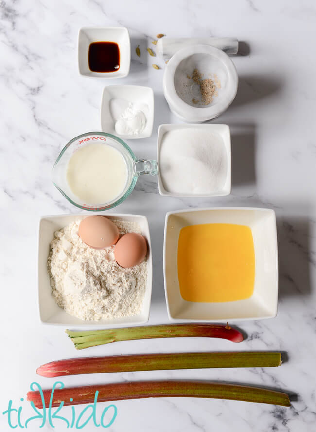 Rhubarb muffin ingredients on a marble surface.