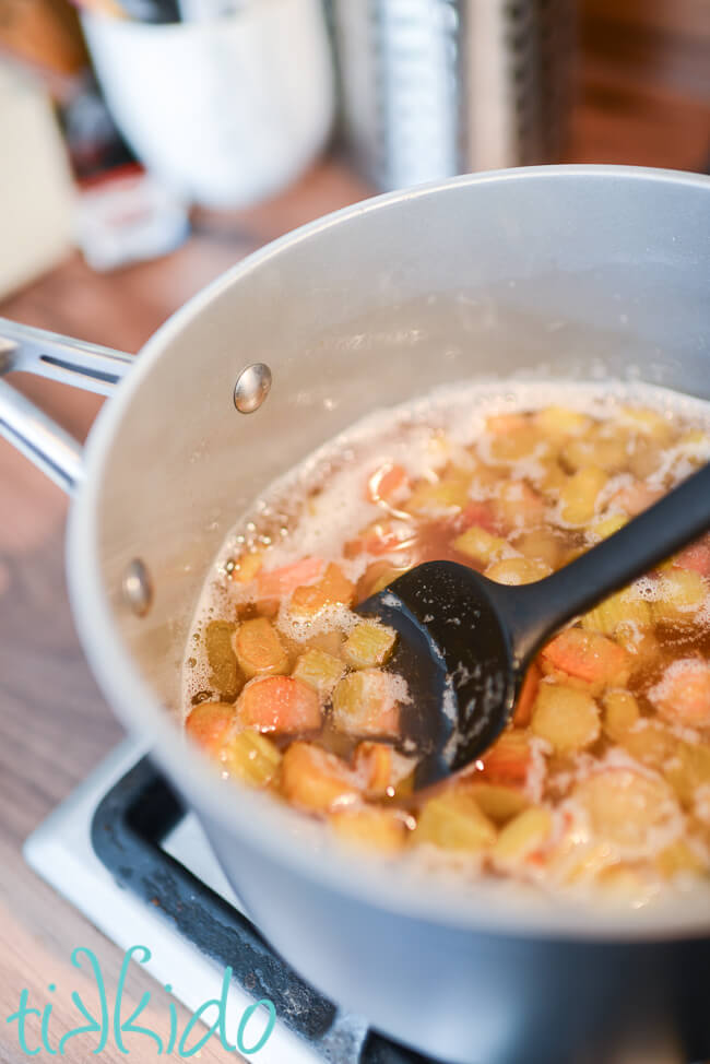 Rhubarb simple syrup cooked in a saucepan.