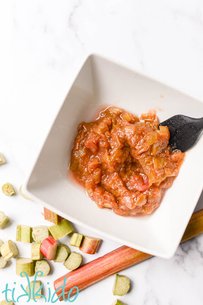 Stewed rhubarb in a white bowl, left over from making rhubarb syrup.