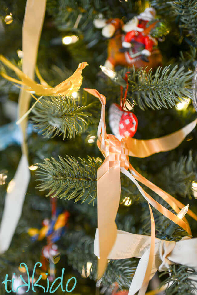 Two Woven Ribbon Bird perched in a Christmas tree.