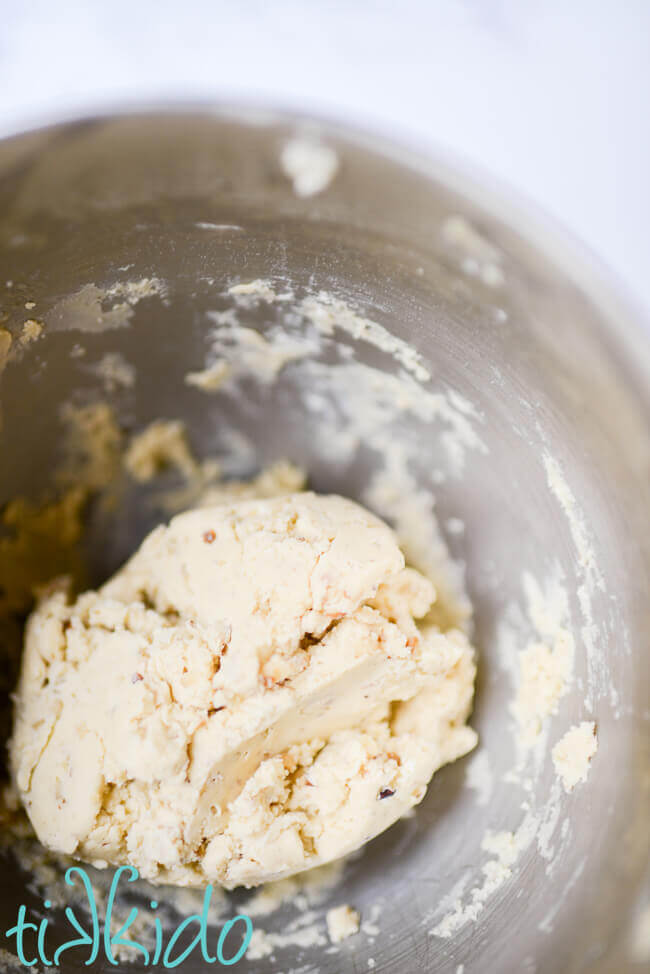 Russian Tea Cakes cookie dough in a silver bowl.