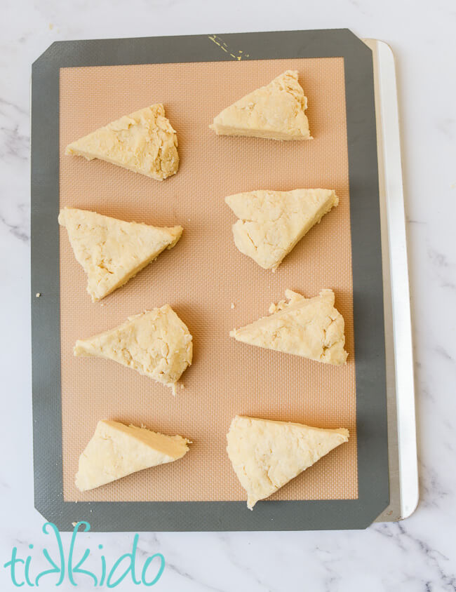 wedge shaped scones dough on a silpat lined baking sheet.