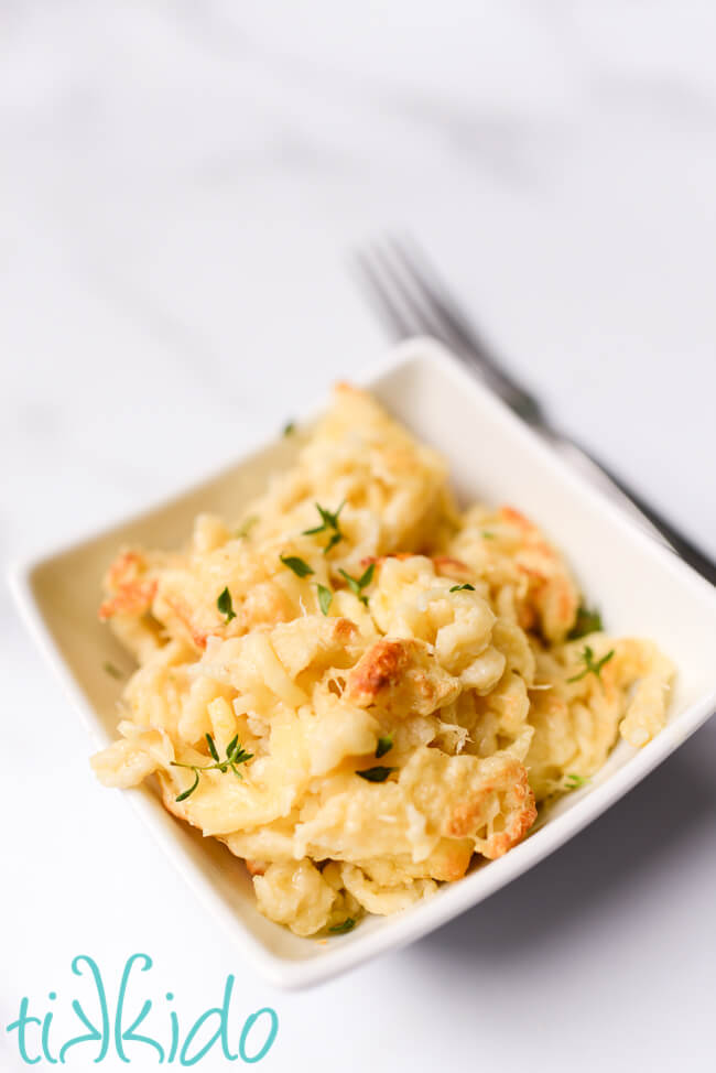 Kaese Spaetzle made with homemade spaetzle recipe in a white bowl.