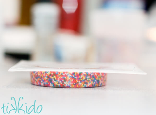 Resin bracelet filled with real sprinkles being made for a Sprinkles themed birthday party.