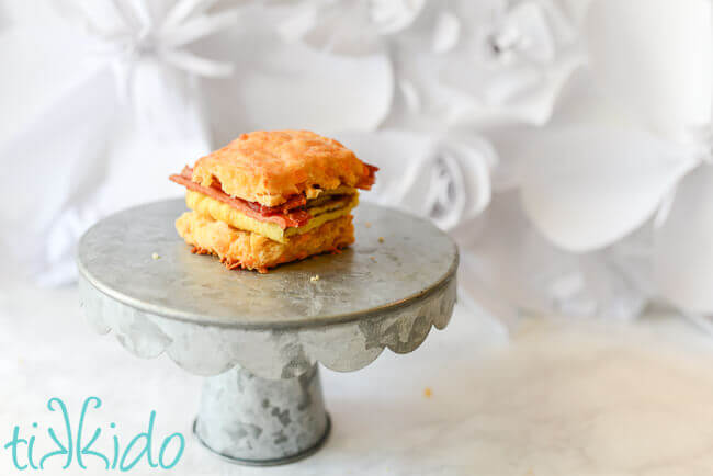 Sriracha Cheddar Biscuit used to make a breakfast sandwich with bacon and egg.