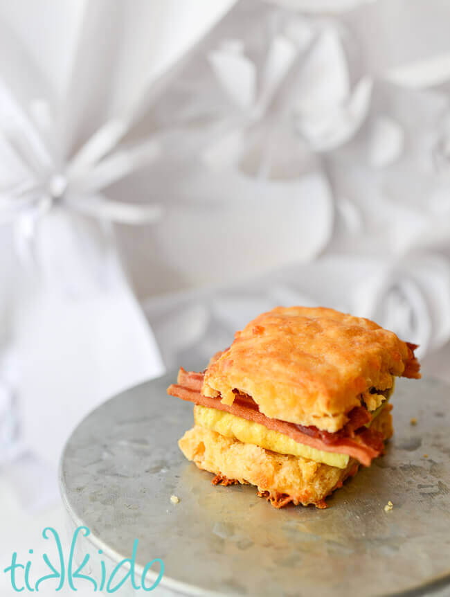Sriracha Cheddar Biscuit used to make a breakfast sandwich with bacon and egg.