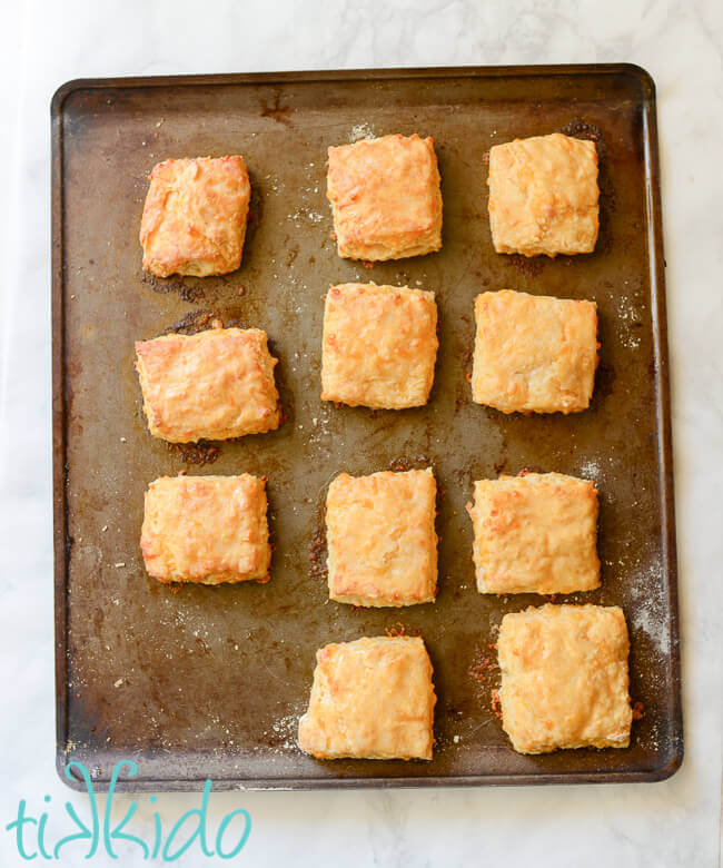 Sriracha Cheddar Biscuits baked on a cookie sheet.