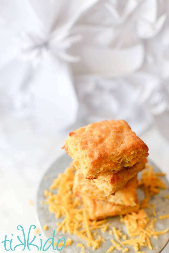 Sriracha Cheddar Biscuits  stacked on a galvanized metal cake stand.