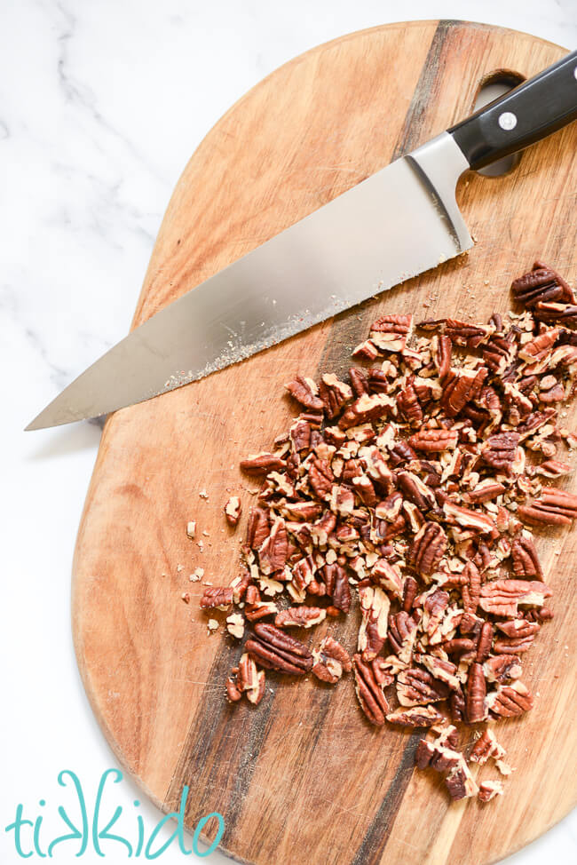 Toasted pecans being chopped for Sticky Buns recipe.