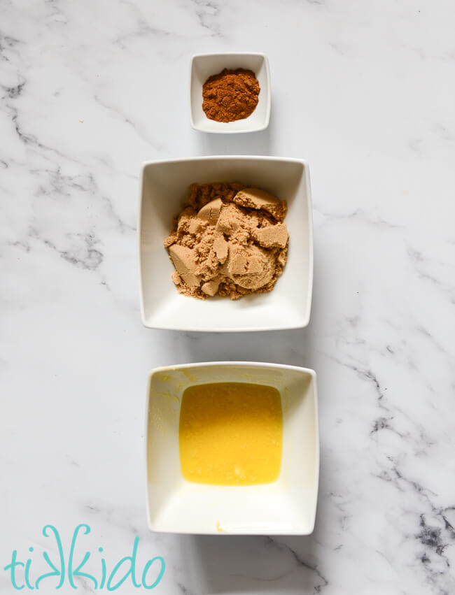 Ingredients for Recipe for Sticky Bun Filling on a white marble surface.