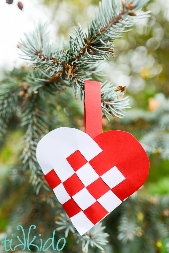 Swedish Paper Heart basket hanging in a Christmas tree.