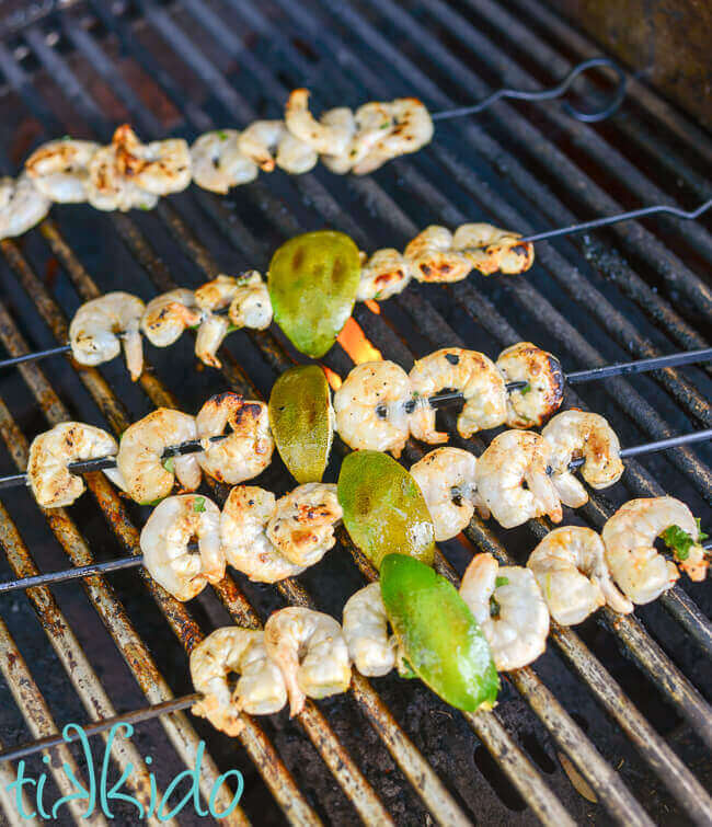 Skewers of tequila lime shrimp being grilled.