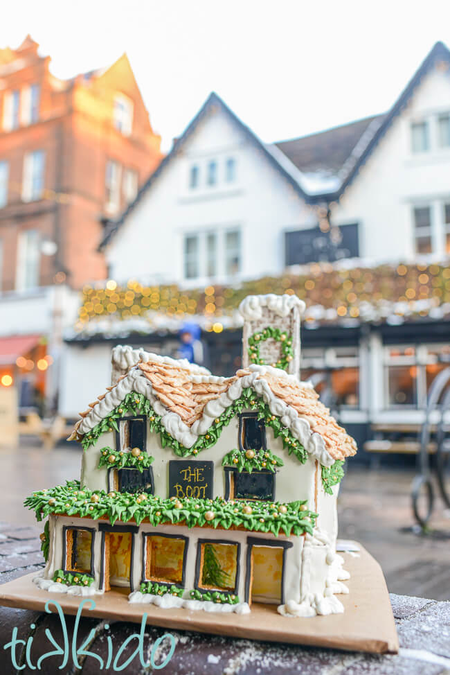 A gingerbread version of The Boot pub in St Albans, England, in front of the actual pub.