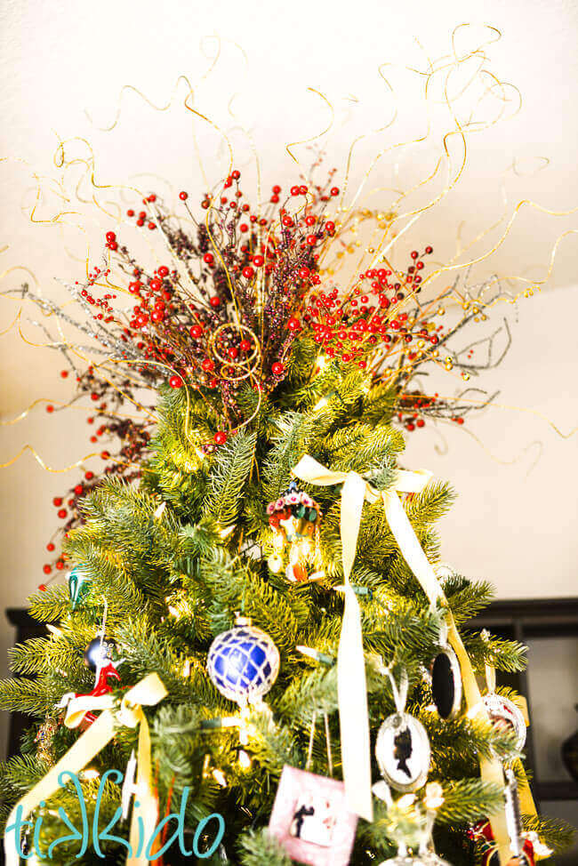 DIY christmas tree topper with picks in red and gold colors.